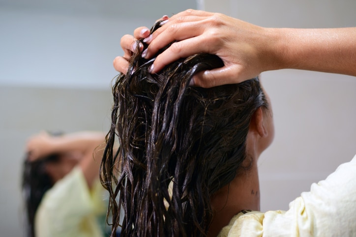 Add shine to your locks using coconut oil