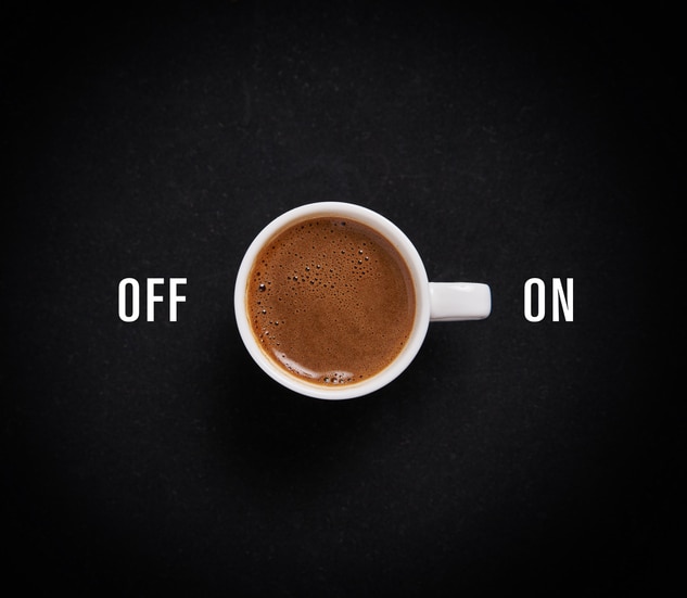 Cup of coffee on black background like switch button