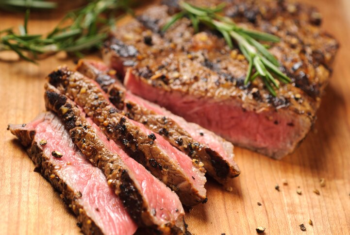 Grilled steak being sliced on a cutting board.  Please see my portfolio for other food related images.