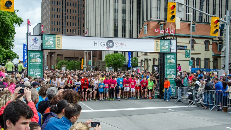 Ottawa, Canada - May 25, 2013: Runners lined up at the start of the Ottawa Race Weekend 5km run as seen on the corner of Laurier Street and Elgin Street