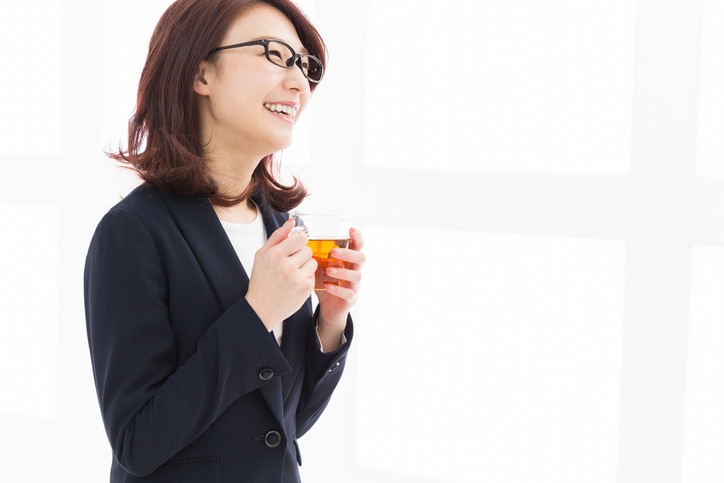 young attractive asian woman who drink tea