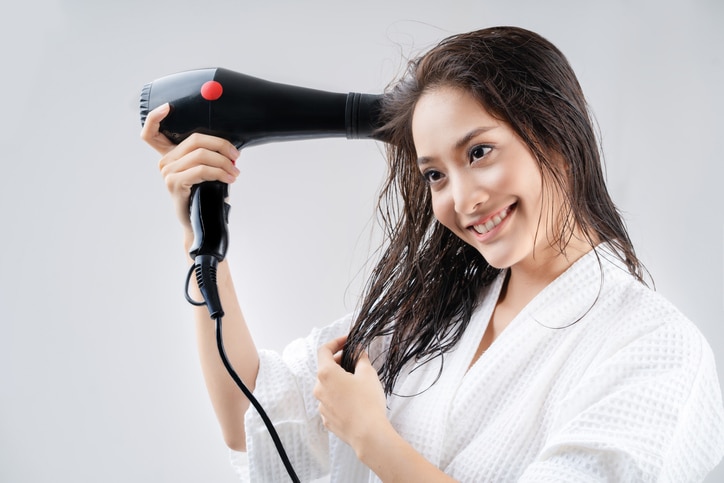 Asian woman drying your hair after showering