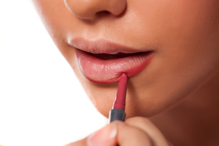 woman applying lip liner