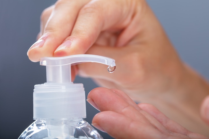 Close-up Of A Woman Using Rubbing Alcohol