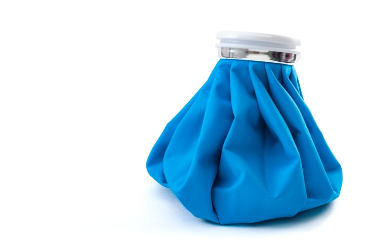 Pain management concept with an Ice pack isolated on white with copy space and a clipping path. An icepack is a bag filled with ice and applied to the body to reduce swelling or lower temperature