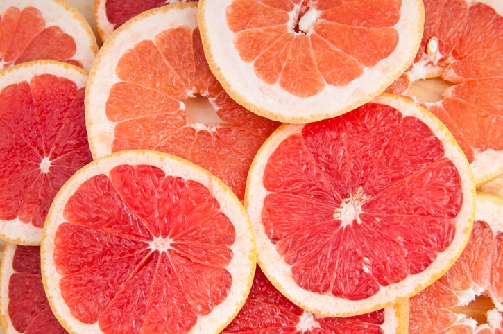 fresh grapefruit and slices backgroundCheck my other fruid and vegetable backgrounds: