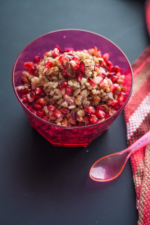 Healthy pomegranate salad with spelt and nuts