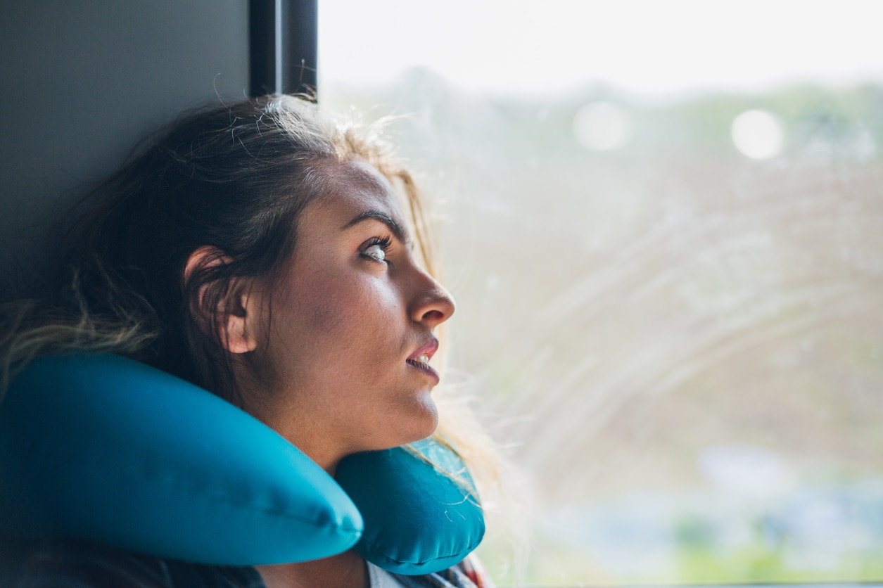 Young pretty woman napping in public transport