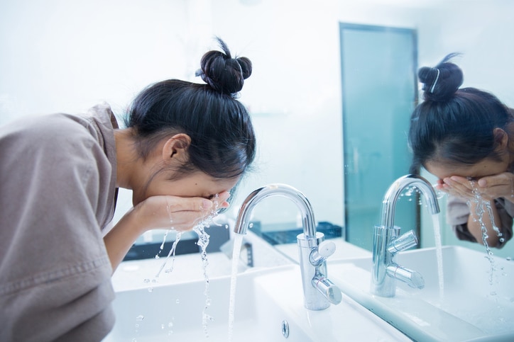 Woman wakes from sleep and she was cleansing the morning before shower