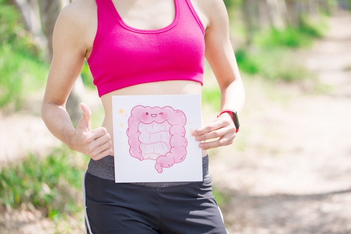 sport woman take intestine board in the forest