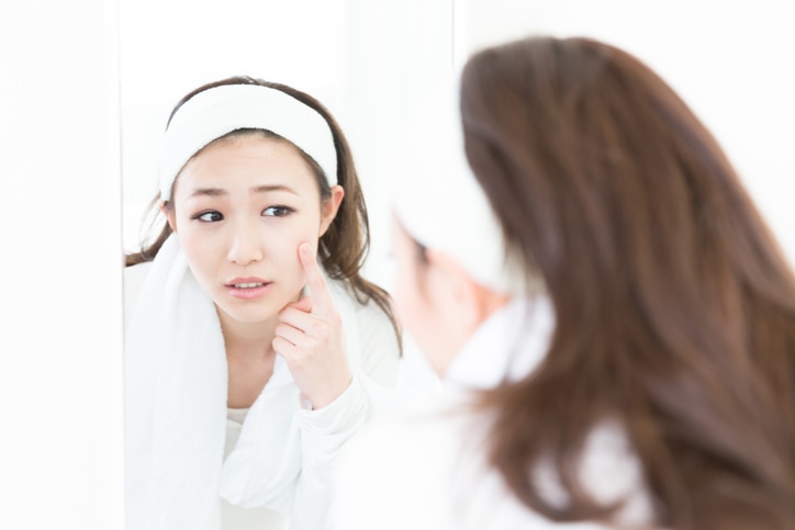 Woman looking in mirror