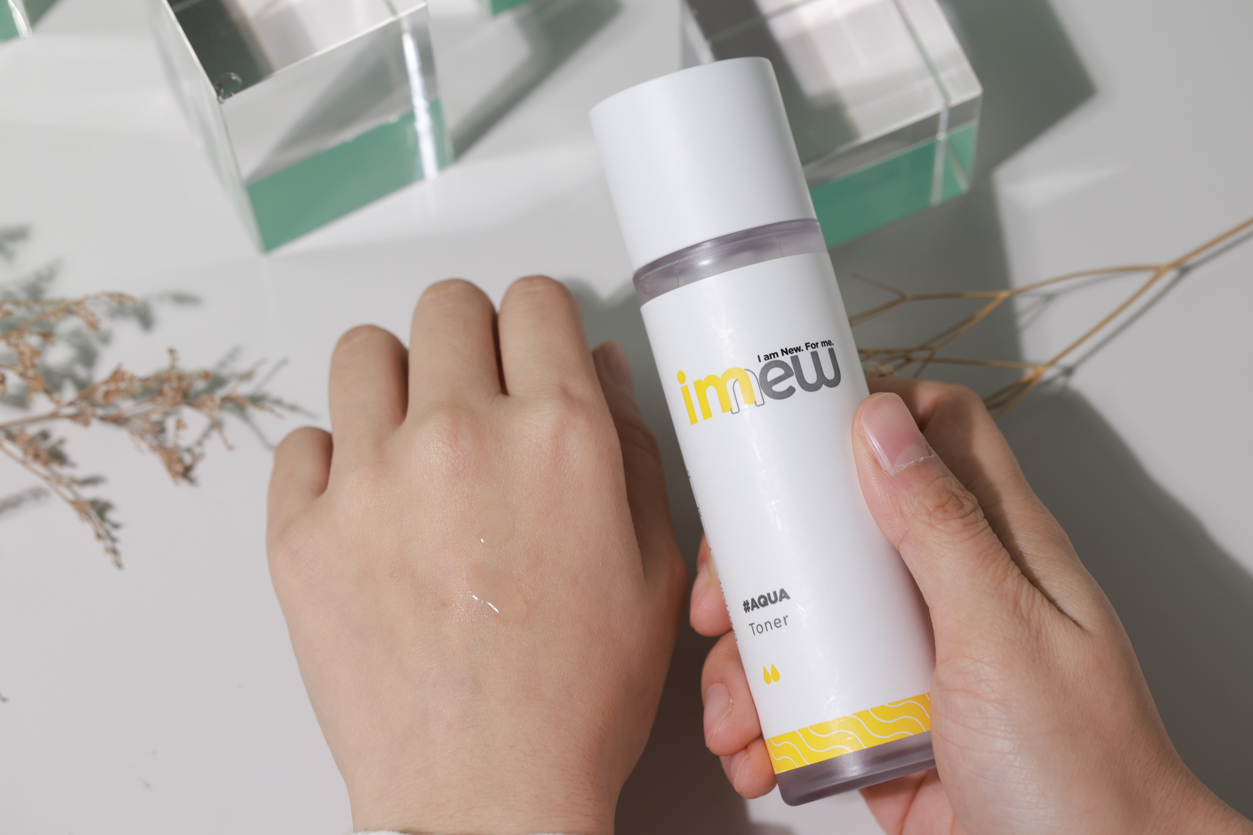 woman hand with Watsons imew Aqua Toner, tested on hand, close up