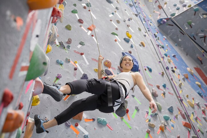 A person climbing a rock wall, MBTI 16 Personalities –  popular leisure activities for ISTP

